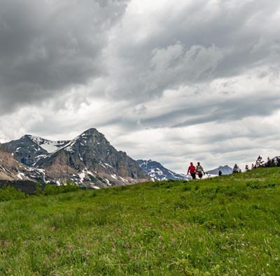 Hikers on a mountain trail in Glacier National Park
