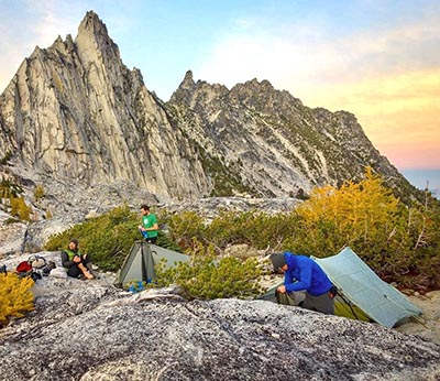 Backpacking shelters set up in a mountain environment